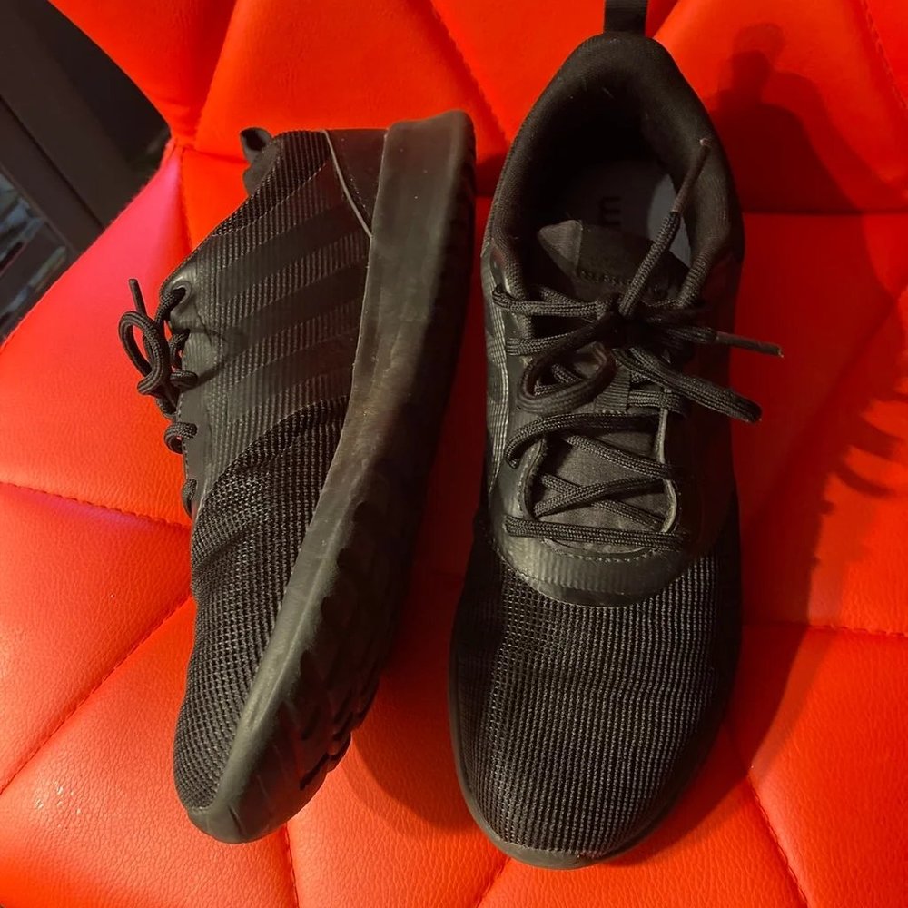 black Adidas athletic shoes